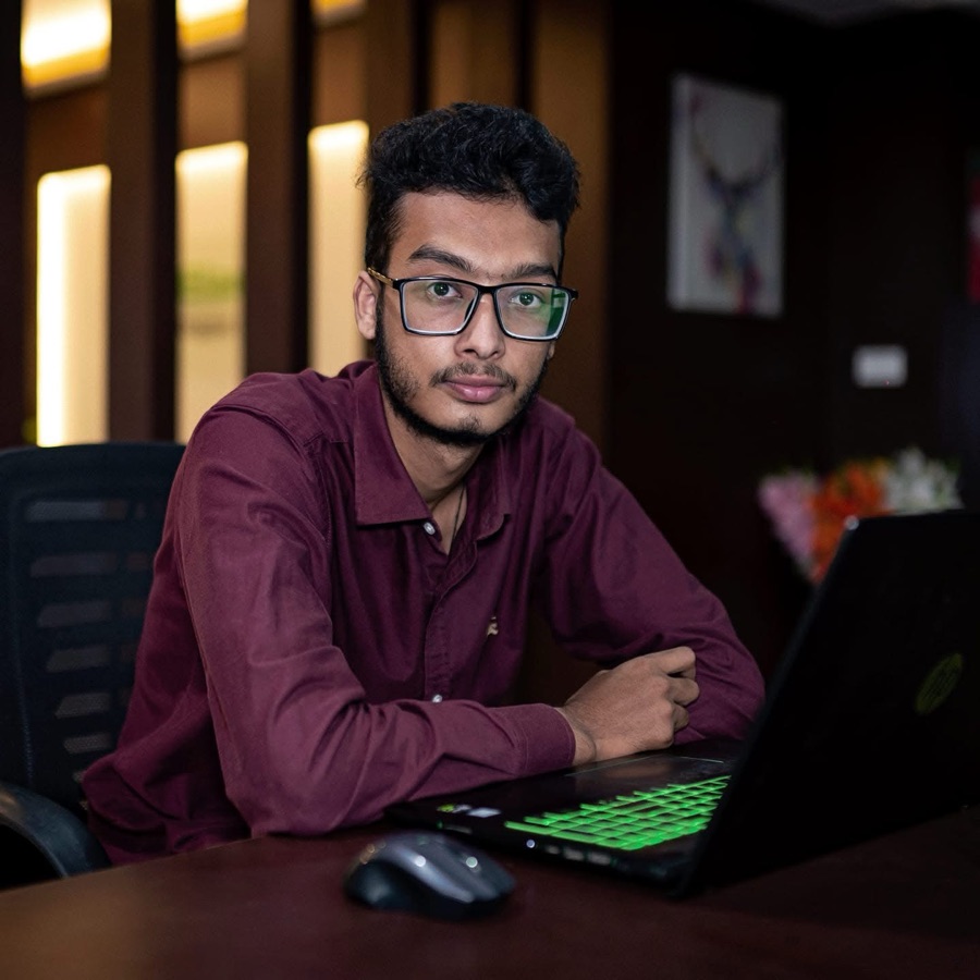 Subesh Thapa, web designer in Essendon, Melbourne, at his desk